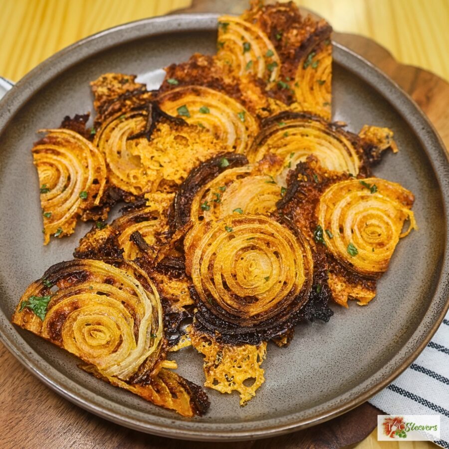 Overhead image of onion chips on a plate