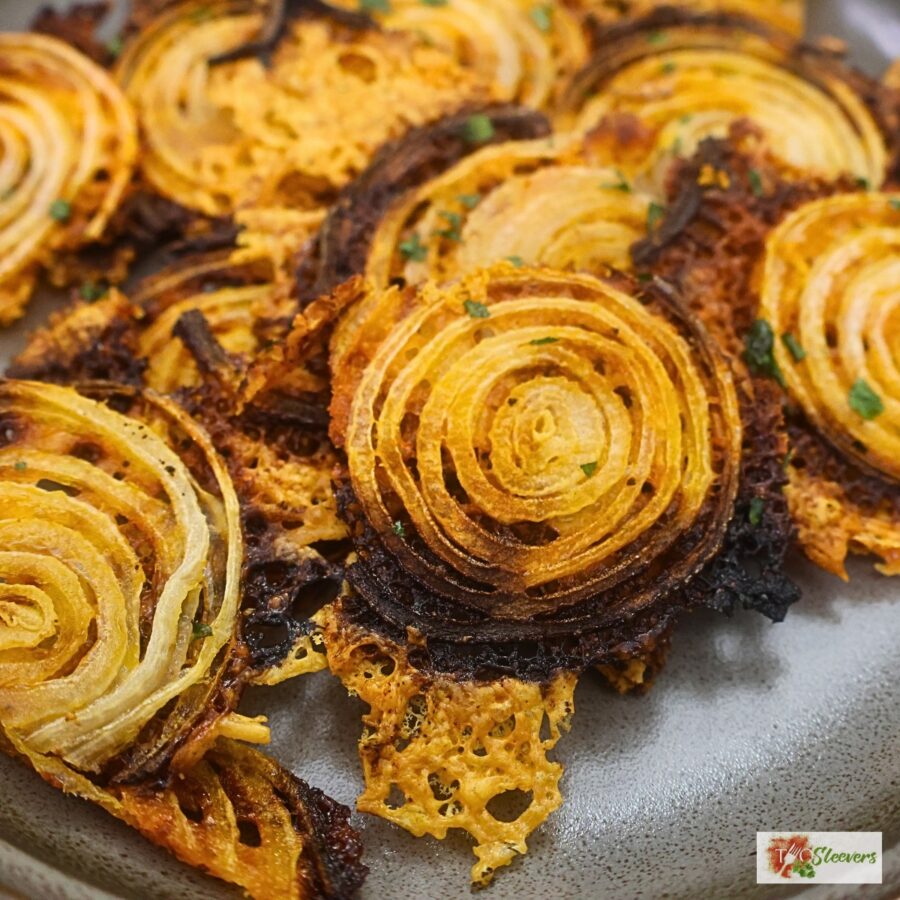 Onion chips cut into pieces on a plate