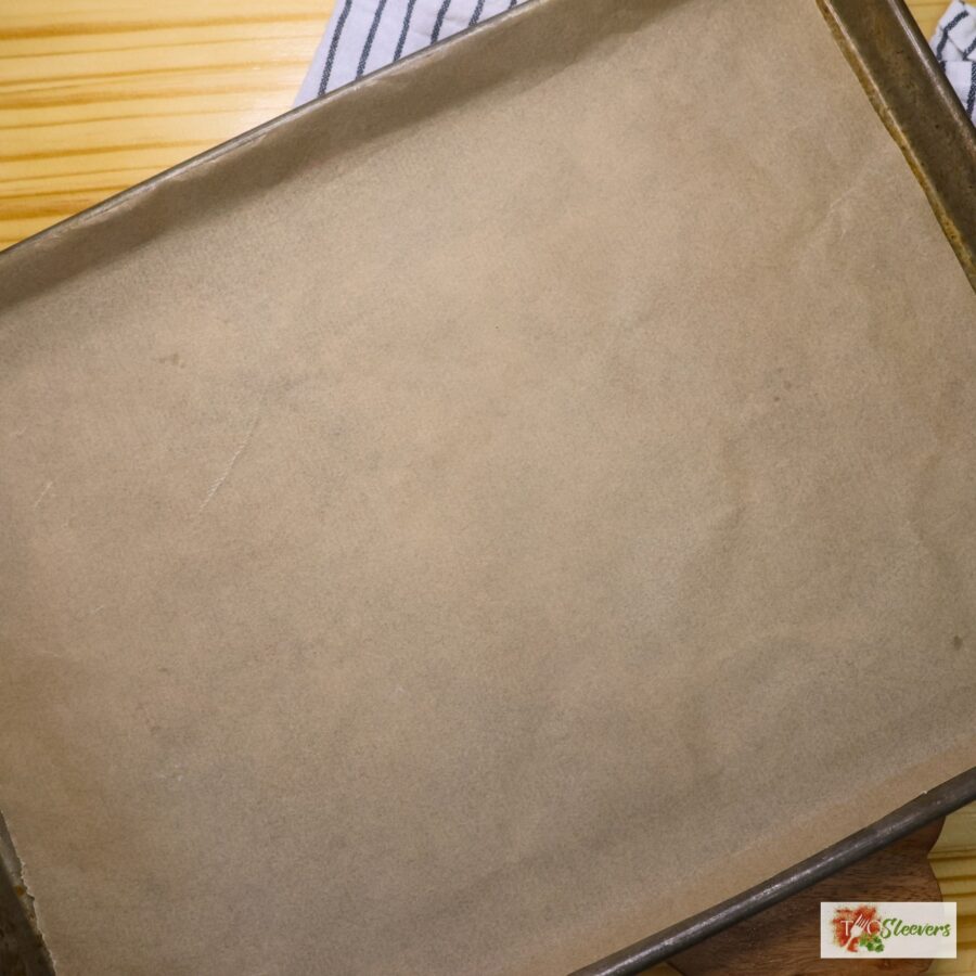 A baking sheet with parchment paper on it