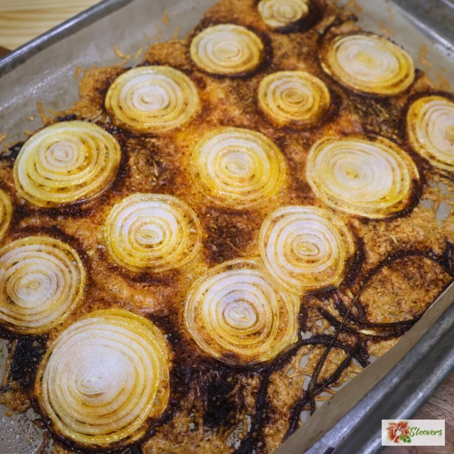 Baked onion chips on parchment paper