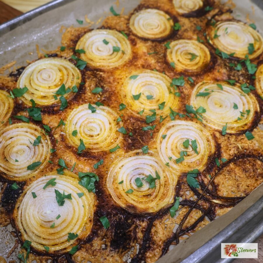 Viral onion chips on a baking sheet with fresh parsley
