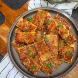 Overhead image of Parmesan Candied Bacon crackers on a plate
