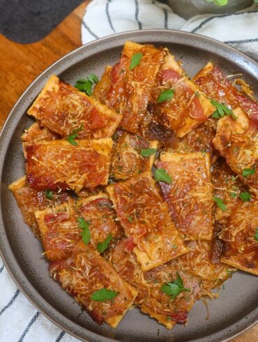 Overhead image of Parmesan Candied Bacon crackers on a plate