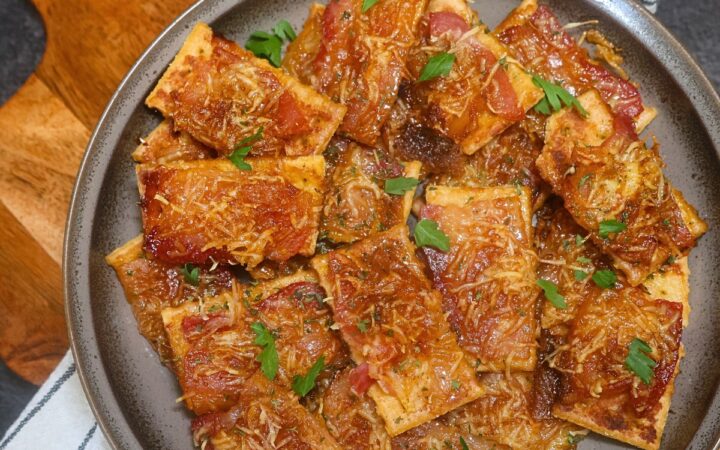 Overhead image of Parmesan Candied Bacon crackers on a plate