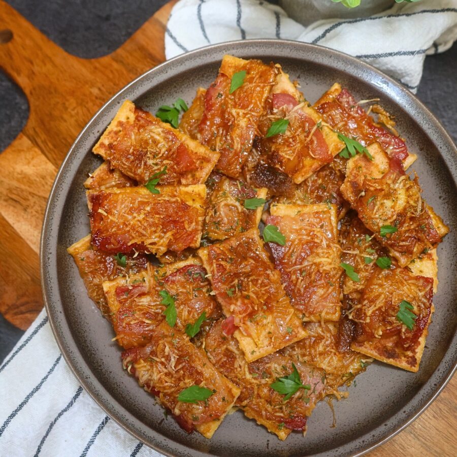 Overhead image of Parmesan Candied Bacon crackers on a plate