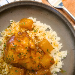 Cooker Close up image of Slow Cooker Hawaiian Chicken on a brown plate