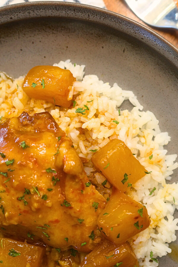 Close up image of Slow Cooker Hawaiian Chicken on a brown plate