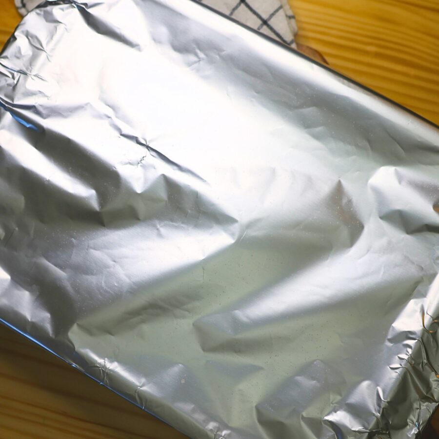 Overhead image of a baking dish covered with foil