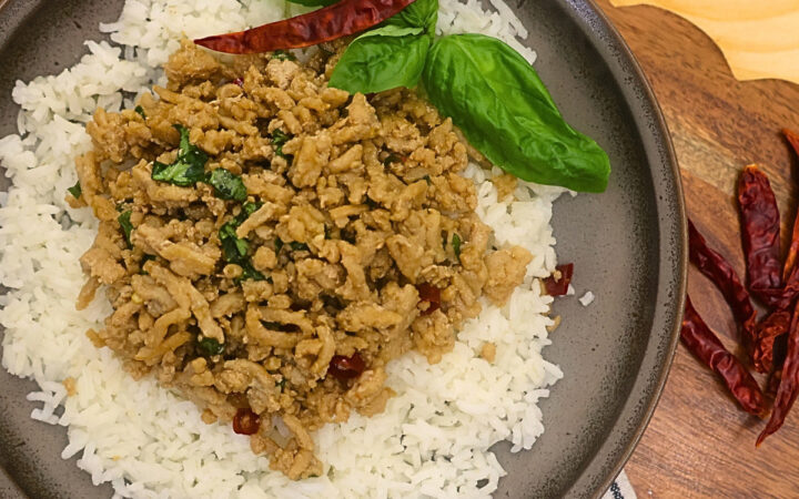 Overhead image of thai basil chicken on a bed of rice