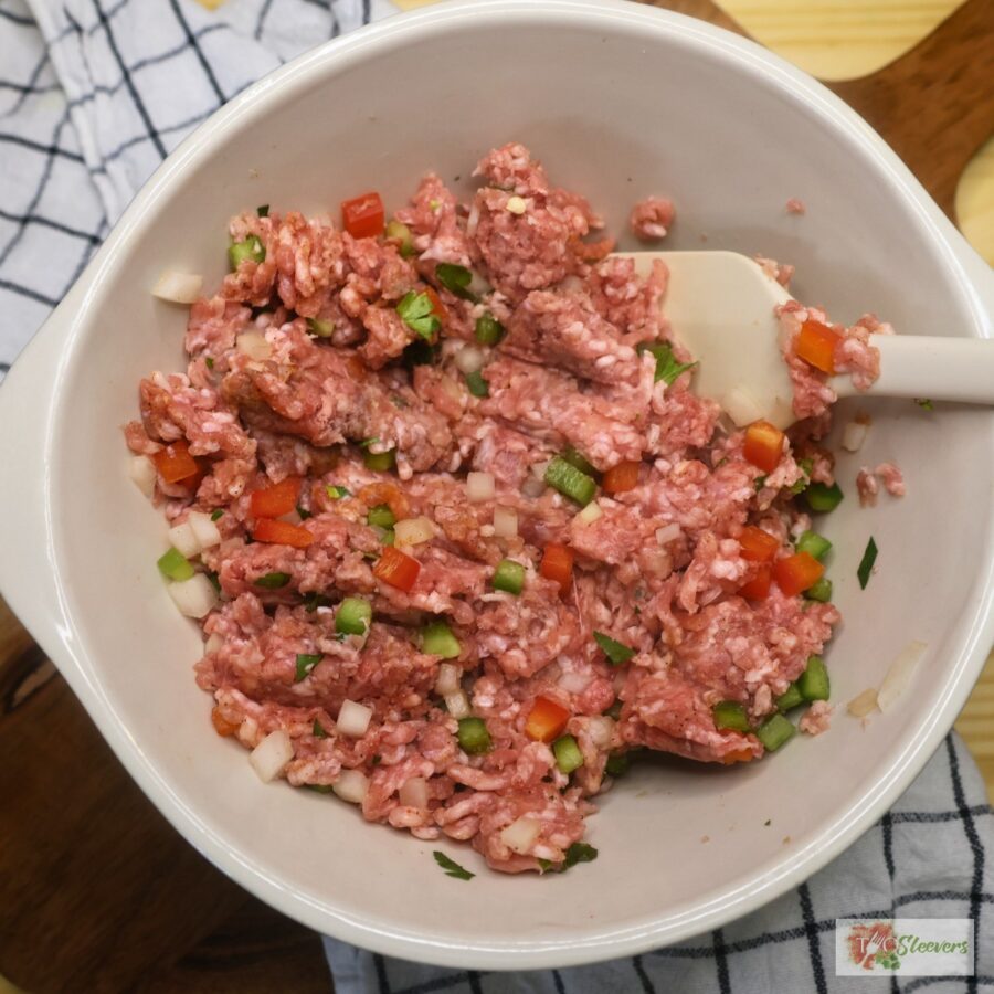 Meat mixture for tortilla kebabs in a mixing bowl