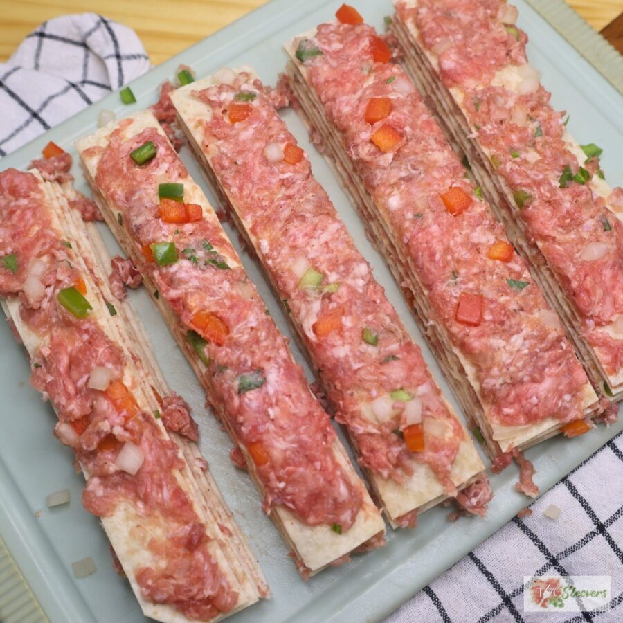 tortilla kebabs cut into five strips on a cutting board