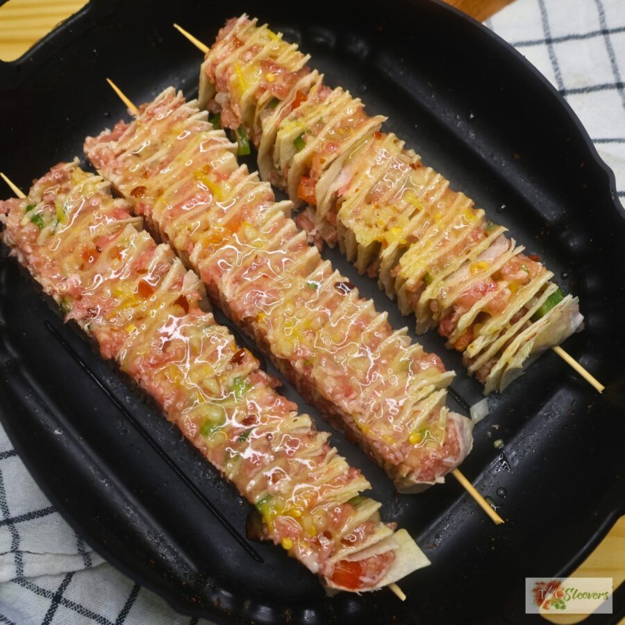 tortilla kebabs in an air fryer basket tray