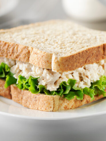 Tuna salad sandwich on a white plate