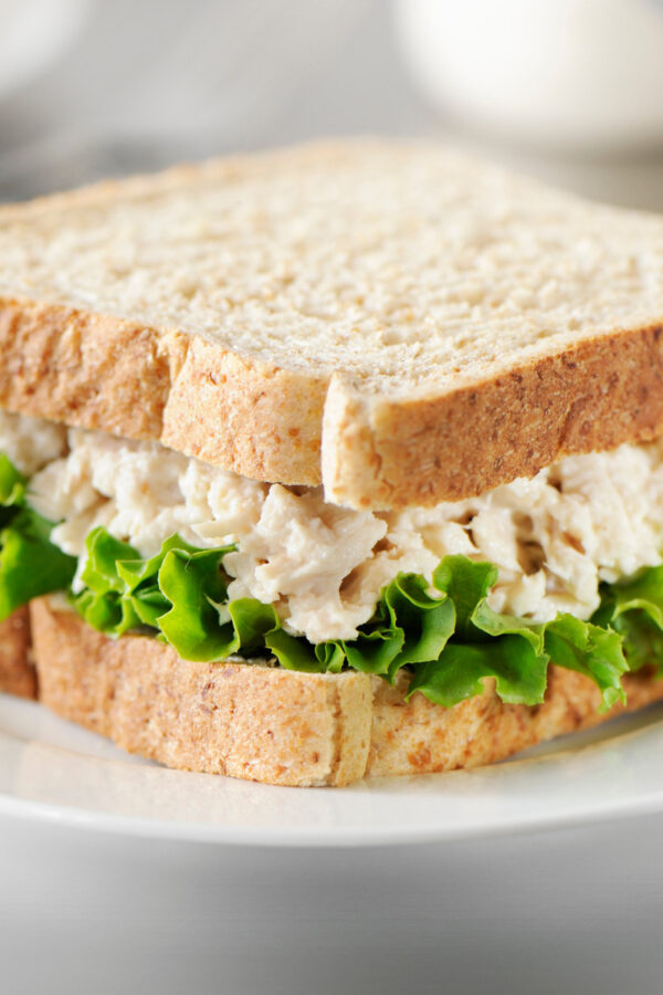 Tuna salad sandwich on a white plate