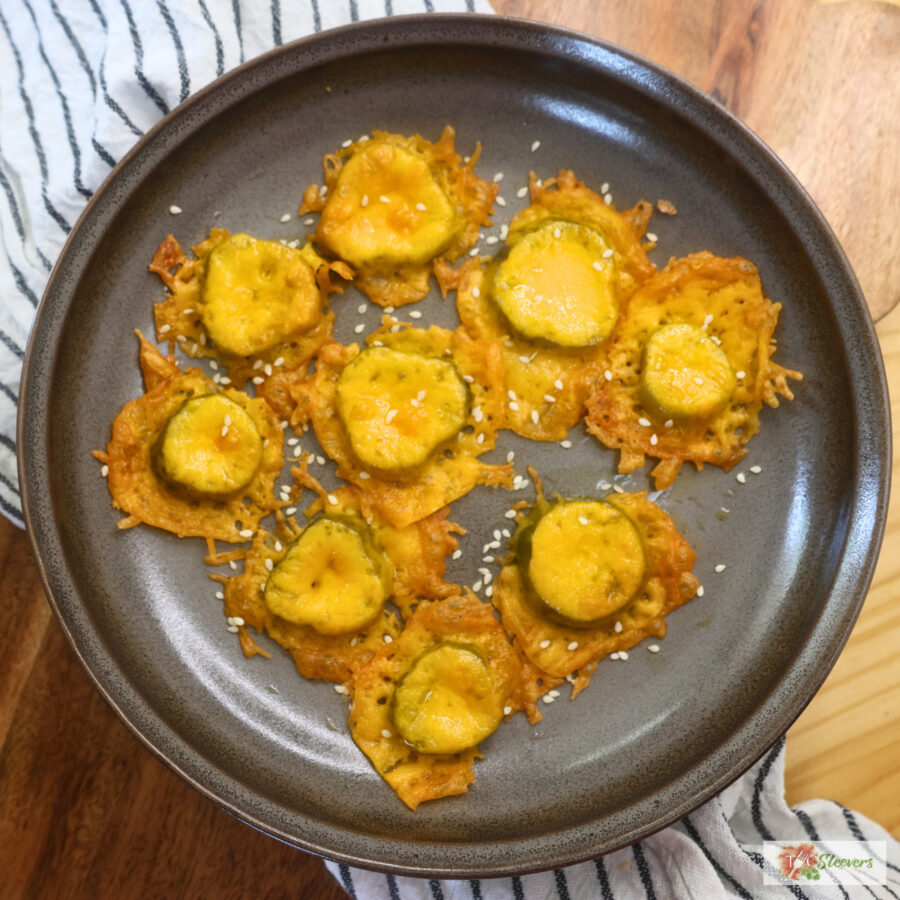 Low Carb Fried Pickles on a plate with sesame seeds