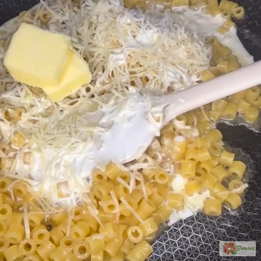 Heavy Cream, Parmesan Cheese, and Unsalted Butter in a pan of cooked ditalini pasta