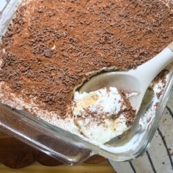 A serving of Greek Yogurt tiramisu being scooped with a serving spoon