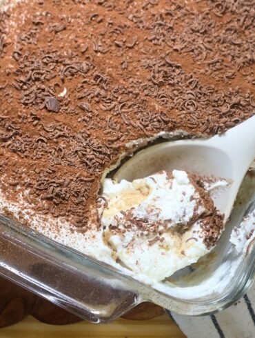 A serving of Greek Yogurt tiramisu being scooped with a serving spoon