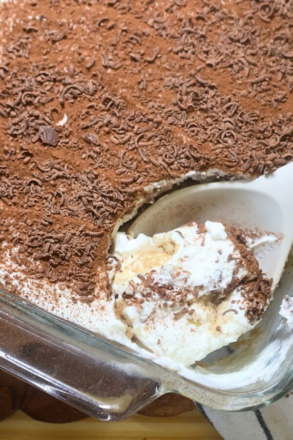 A serving of Greek Yogurt tiramisu being scooped with a serving spoon