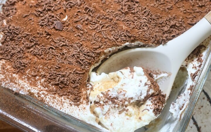 A serving of Greek Yogurt tiramisu being scooped with a serving spoon
