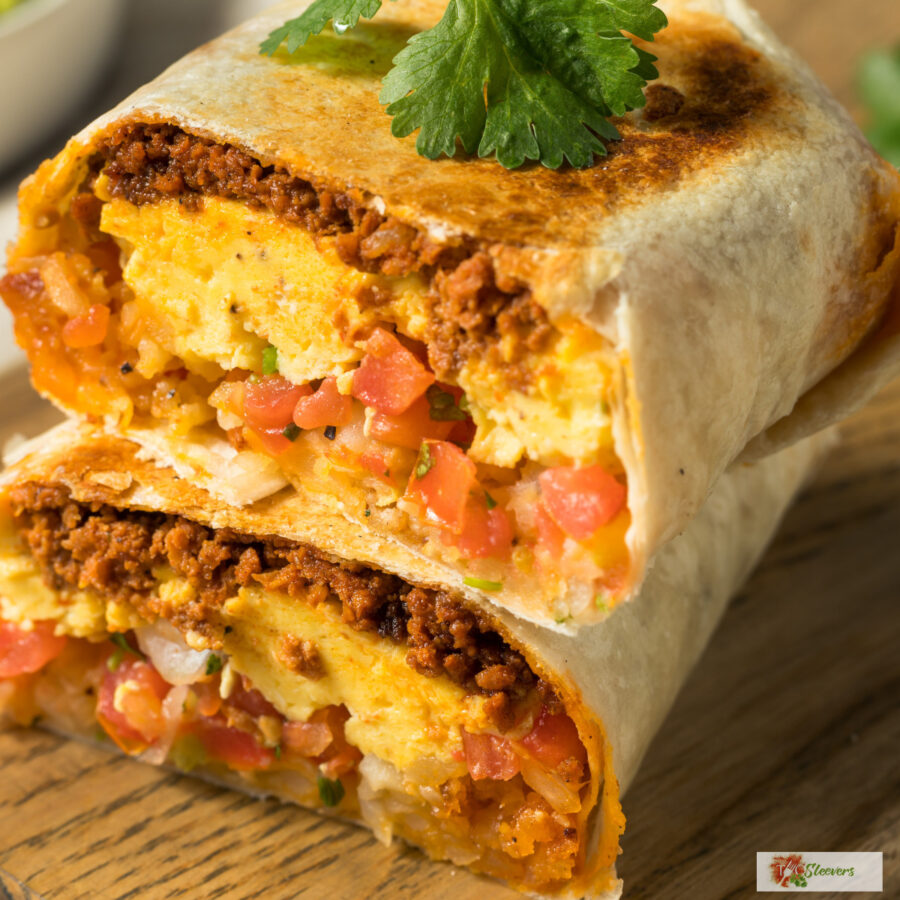 A chorizo breakfast burrito cut in half and stacked on top of each other