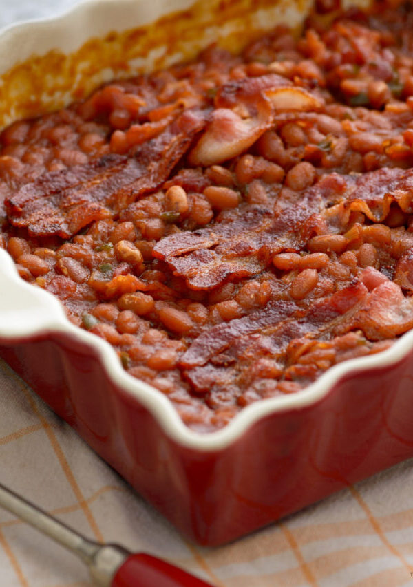 Baked Beans and Bacon in a red baking dish