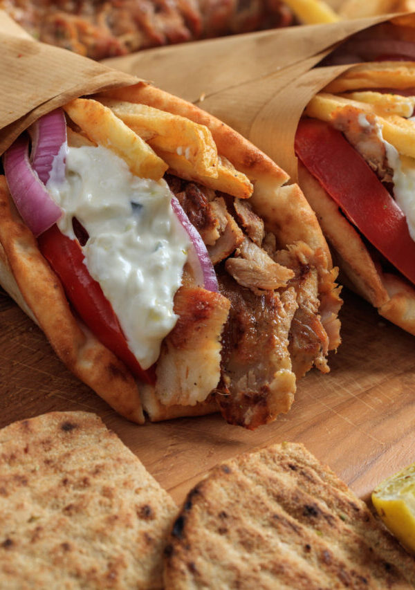 Two Chicken Gyros wrapped in parchment paper