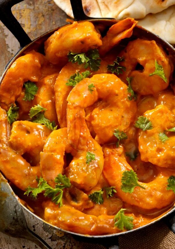 Overhead image of Curry Shrimp in a pan with cilantro for garnish